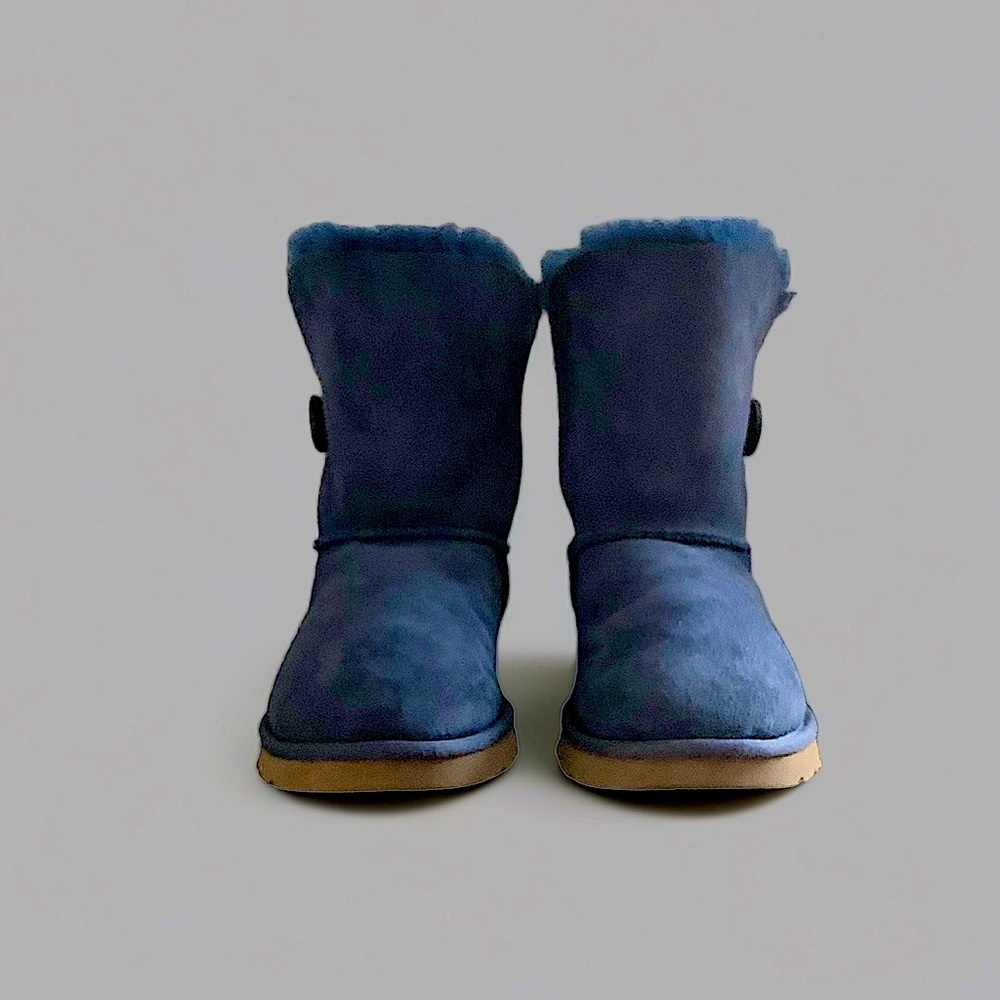 Navy blue, fur-lined, suede UGG ankle boots. Rubber soles, button & hook detail.